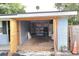 Spacious garage featuring shelving units, washer and dryer, and wide entrance at 1131 Martha Dr, Daytona Beach, FL 32114