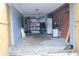 Spacious garage featuring shelving units, washer and dryer, and brick accents at 1131 Martha Dr, Daytona Beach, FL 32114