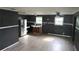 Open-concept kitchen with new stainless steel refrigerator, ample space, and natural light at 1131 Martha Dr, Daytona Beach, FL 32114