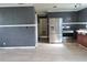 Kitchen with stainless steel fridge, range, and a doorway leading to another room at 1131 Martha Dr, Daytona Beach, FL 32114