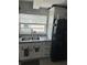 Clean kitchen featuring stainless steel sink and black refrigerator at 1218 Daytona Ave, Daytona Beach, FL 32117