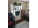 Cozy living room featuring hardwood floors, a rocking chair, and a television cabinet at 1218 Daytona Ave, Daytona Beach, FL 32117