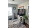 Relaxing living room with TV, entertainment center, and hardwood floors at 1218 Daytona Ave, Daytona Beach, FL 32117
