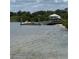 Waterfront view of boat dock and trees at 1218 Daytona Ave, Daytona Beach, FL 32117