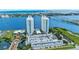 Stunning aerial view of waterfront condos with scenic water views and manicured landscaping at 231 Riverside Dr # 1602, Holly Hill, FL 32117