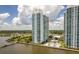 Stunning aerial view of luxury high-rise condos with a swimming pool and waterfront access on a sunny day at 231 Riverside Dr # 1602, Holly Hill, FL 32117