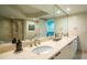 Bathroom showcasing a large vanity, bathtub, and glass shower at 231 Riverside Dr # 1602, Holly Hill, FL 32117