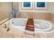Elegant bathtub with brown tray and stylish vases for a luxurious bathing experience at 231 Riverside Dr # 1602, Holly Hill, FL 32117