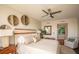 Relaxing bedroom with king bed, ceiling fan, calm decor and comfortable furnishings at 231 Riverside Dr # 1602, Holly Hill, FL 32117