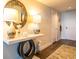 Inviting entryway featuring stylish console table, decor, and a textured rug on beautiful hardwood floors at 231 Riverside Dr # 1602, Holly Hill, FL 32117