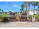 Outdoor grilling area featuring stainless steel grills and picnic tables at 231 Riverside Dr # 1602, Holly Hill, FL 32117