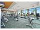 Well-equipped gym with modern exercise machines and floor-to-ceiling windows with scenic views at 231 Riverside Dr # 1602, Holly Hill, FL 32117
