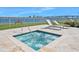 Relaxing hot tub with lounge chairs and views of the surrounding waterway at 231 Riverside Dr # 1602, Holly Hill, FL 32117