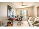 Modern office with large painting, comfortable seating, and city view window at 231 Riverside Dr # 1602, Holly Hill, FL 32117