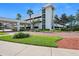 Multi-level parking garage featuring well-maintained landscaping and pedestrian access at 231 Riverside Dr # 1602, Holly Hill, FL 32117