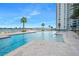 Beautiful pool area with clear blue water and a stunning waterfront view at 231 Riverside Dr # 1602, Holly Hill, FL 32117