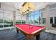 Close-up of the pool table in the game room with plenty of natural light at 231 Riverside Dr # 1602, Holly Hill, FL 32117