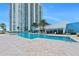 Resort-style pool with sundeck and views of the high-rise condominium tower at 231 Riverside Dr # 1602, Holly Hill, FL 32117