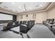 Private theater with plush seating, projector screen, and ambient lighting at 231 Riverside Dr # 1602, Holly Hill, FL 32117
