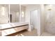 Bright bathroom featuring a neutral color palette, geometric tile accents, and a glass-enclosed shower at 2360 Ocean Shore Blvd # 10, Ormond Beach, FL 32176