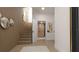Elegant hallway features modern elevator, stylish wood wall panels, staircase, and decorative mirrors at 2360 Ocean Shore Blvd # 10, Ormond Beach, FL 32176