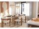 Bright dining room featuring a large table set for a meal, modern lighting and decor at 2360 Ocean Shore Blvd # 13, Ormond Beach, FL 32176
