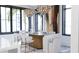 Elegant dining room with sophisticated light fixtures, stylish chairs, and a marble-topped dining table set at 2360 Ocean Shore Blvd # 24, Ormond Beach, FL 32176