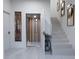 Bright hallway featuring modern design elements, staircase, and elevator providing convenience and style at 2360 Ocean Shore Blvd # 24, Ormond Beach, FL 32176