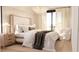Serene main bedroom featuring a large bed, soft lighting, and balcony access with sheer curtains at 2360 Ocean Shore Blvd # 4, Ormond Beach, FL 32176