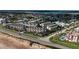 Stunning aerial view of new townhome construction with waterfront access and beautiful landscaping at 2360 Ocean Shore Blvd # 7, Ormond Beach, FL 32176