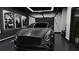 Luxury garage featuring a sleek gray Bentley, vintage car prints, and modern lighting at 2360 Ocean Shore Blvd # 8, Ormond Beach, FL 32176