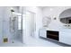 The bathroom features a seamless glass shower with brass hardware and double sink vanities at 2360 Ocean Shore Blvd # 9, Ormond Beach, FL 32176
