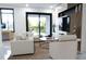 Bright living room features an entertainment center, a large sectional, and a sliding glass door to a balcony at 2360 Ocean Shore Blvd # 9, Ormond Beach, FL 32176