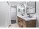 Modern bathroom with a double vanity, framed mirrors, contemporary lighting, and stylish hexagon tile at 2531 Needle Palm Dr, Edgewater, FL 32141