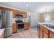 Kitchen with stainless steel appliances, light countertops, and wooden cabinetry at 2531 Needle Palm Dr, Edgewater, FL 32141