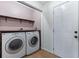 Laundry room featuring a washer, dryer and access door at 2531 Needle Palm Dr, Edgewater, FL 32141