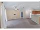 Bright living area features neutral walls, a ceiling fan, and an open-concept design with kitchen access at 2531 Needle Palm Dr, Edgewater, FL 32141
