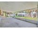 Spacious screened porch with a concrete floor and screened walls overlooking the yard at 2531 Needle Palm Dr, Edgewater, FL 32141