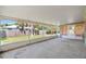 A covered and screened-in porch with a concrete floor provides outdoor living space at 2531 Needle Palm Dr, Edgewater, FL 32141