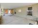 A view of the covered porch from the interior showing the concrete flooring and decorative sign at 2531 Needle Palm Dr, Edgewater, FL 32141