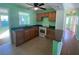 Functional kitchen with essential appliances, ample counter space, and connecting access to other rooms at 264 Sherwood Ln, Daytona Beach, FL 32117