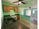 Bright kitchen featuring essential appliances and a breakfast bar, providing a comfortable cooking space at 264 Sherwood Ln, Daytona Beach, FL 32117
