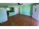 Inviting living room featuring gleaming hardwood floors, ceiling fan, and abundant natural light at 264 Sherwood Ln, Daytona Beach, FL 32117