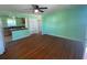Inviting living room featuring gleaming hardwood floors, ceiling fan, and abundant natural light at 264 Sherwood Ln, Daytona Beach, FL 32117