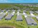Aerial view of neighborhood homes with green lawns and trees leading to the wooded preserve at 2836 Monaghan Dr, Ormond Beach, FL 32174