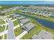 Aerial view of a modern neighborhood with ponds, lakes, wooded areas and similar style homes at 2836 Monaghan Dr, Ormond Beach, FL 32174