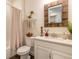 Bathroom with shower, vanity, mirror, toilet, decor and dark floors at 2836 Monaghan Dr, Ormond Beach, FL 32174