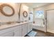 Bright bathroom features double sinks, a soaking tub, and a separate shower at 2836 Monaghan Dr, Ormond Beach, FL 32174