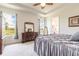 Spacious bedroom with dressers, neutral colors, and a large window offering outdoor views at 2836 Monaghan Dr, Ormond Beach, FL 32174