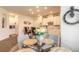 The dining area has a glass table and is open to the kitchen at 2836 Monaghan Dr, Ormond Beach, FL 32174